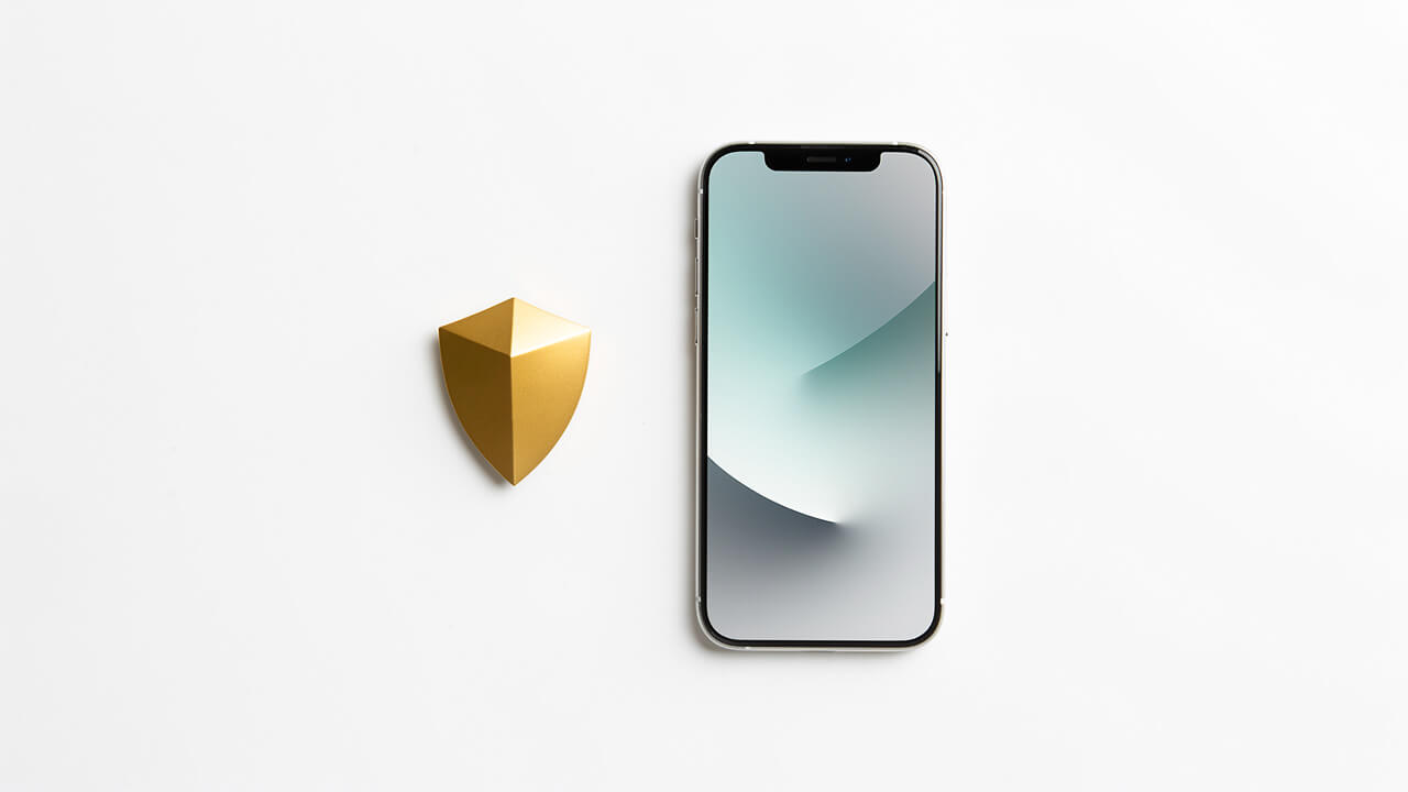 Smartphone and gold shield symbolizing digital brand safety controls