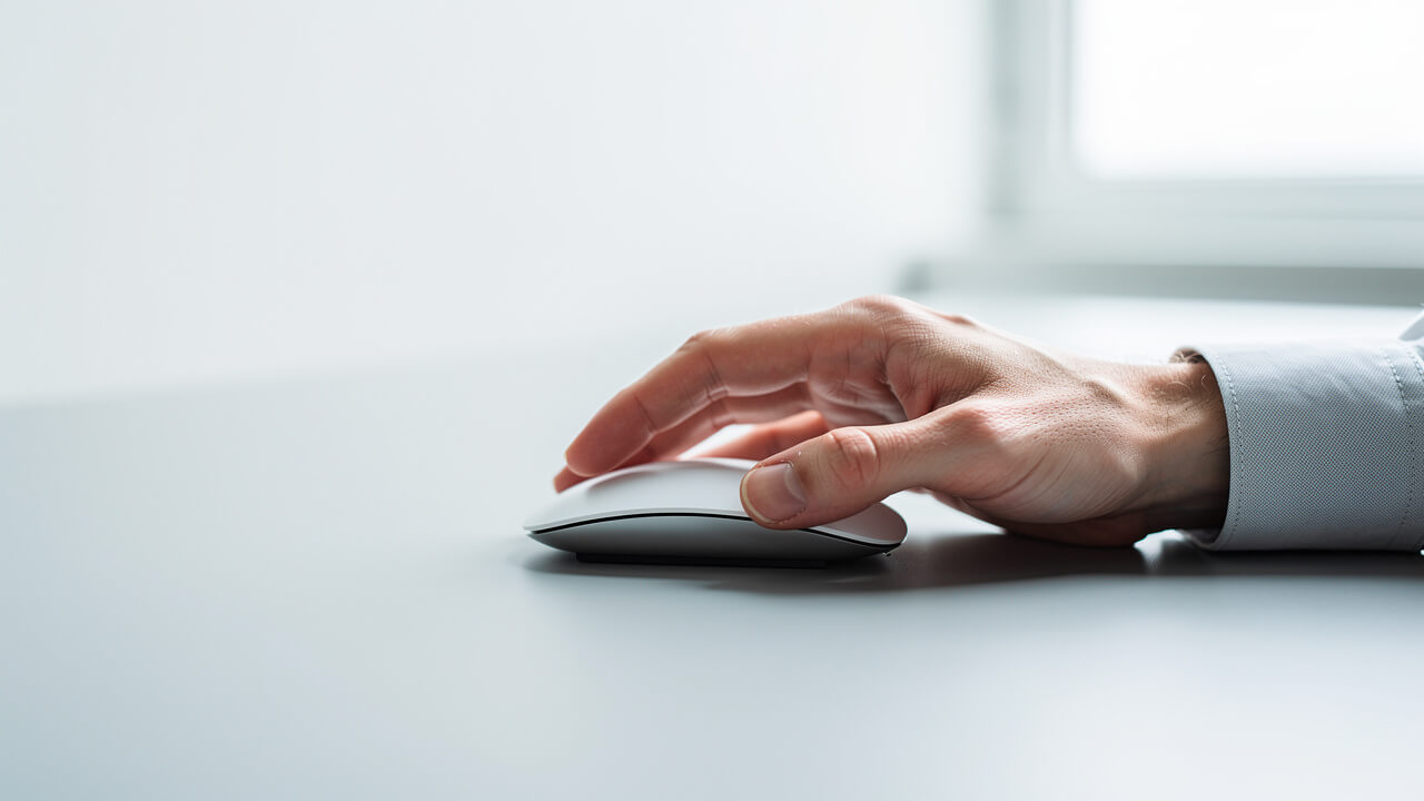 Hand using mouse to configure Facebook Pixel event tracking