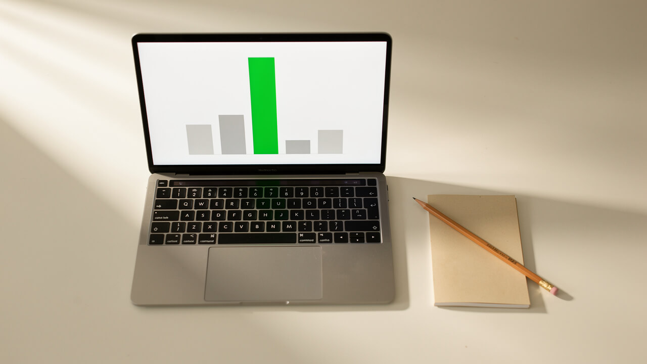 Laptop showing ad campaign performance chart for conversion setup